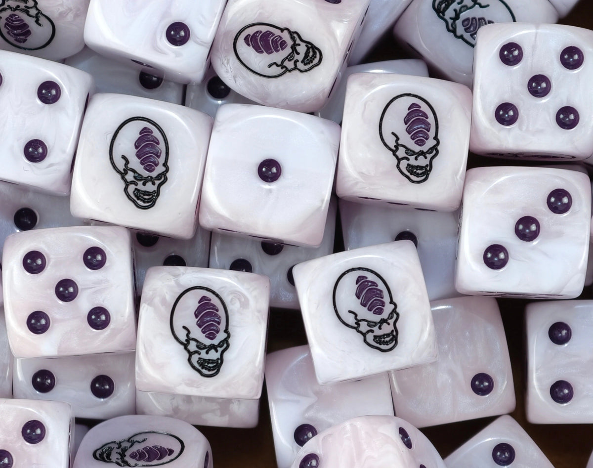 A pile of pale Genestealer dice with purple pips and a violet gem head