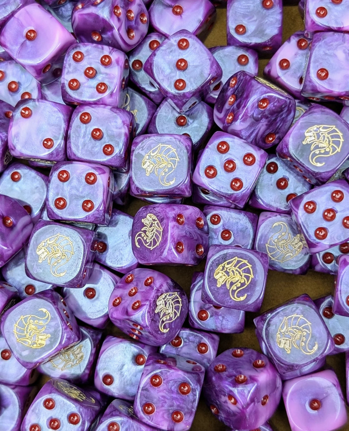 Pile of purple alien swarm 16mm D6 dice for a sci-fi hive fleet