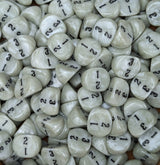 Pile of white D3 three sided dice for tabletop games