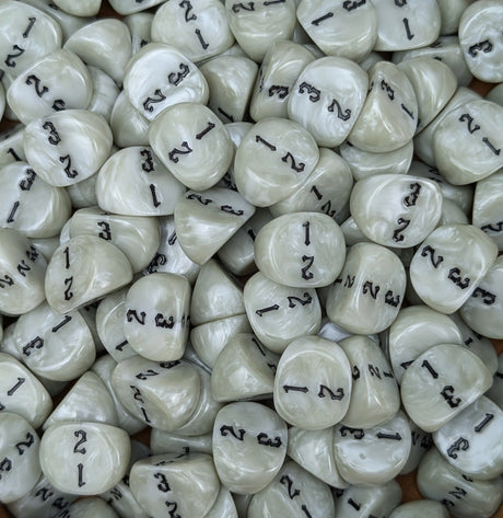 Pile of white D3 three sided dice for tabletop games