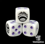 Close up of a white 16mm resin D6 die engraved with a black grinning emblem and purple pips