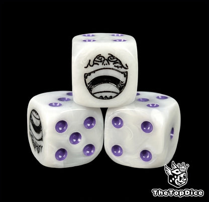 Close up of a white 16mm resin D6 die engraved with a black grinning emblem and purple pips