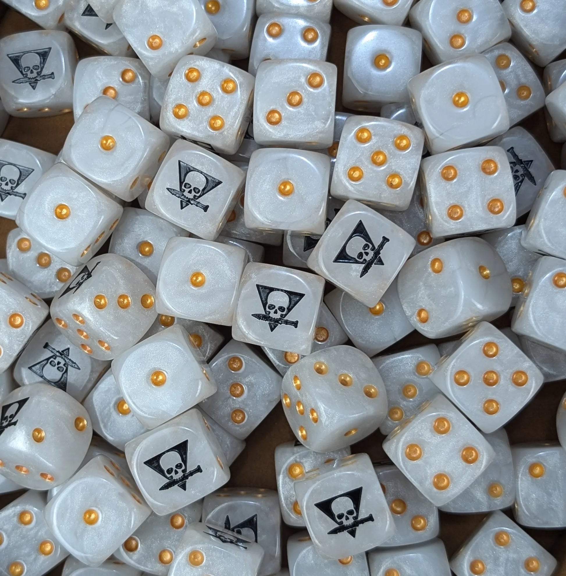 Pile of white skull squad 16mm D6 dice for a sci-fi skirmish team