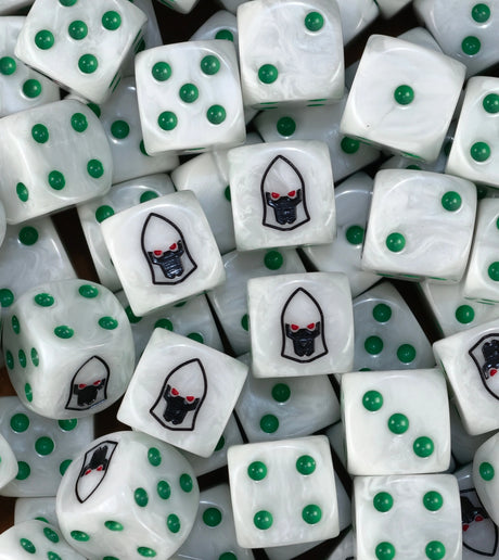 A pile of pearl white Biel-Tan dice with green pips and black helms