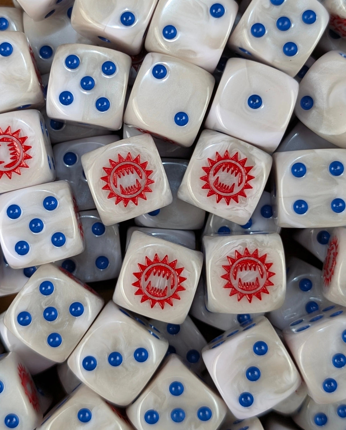 Pile of white and grey toothed maw 16mm D6 dice for a sci-fi legion army