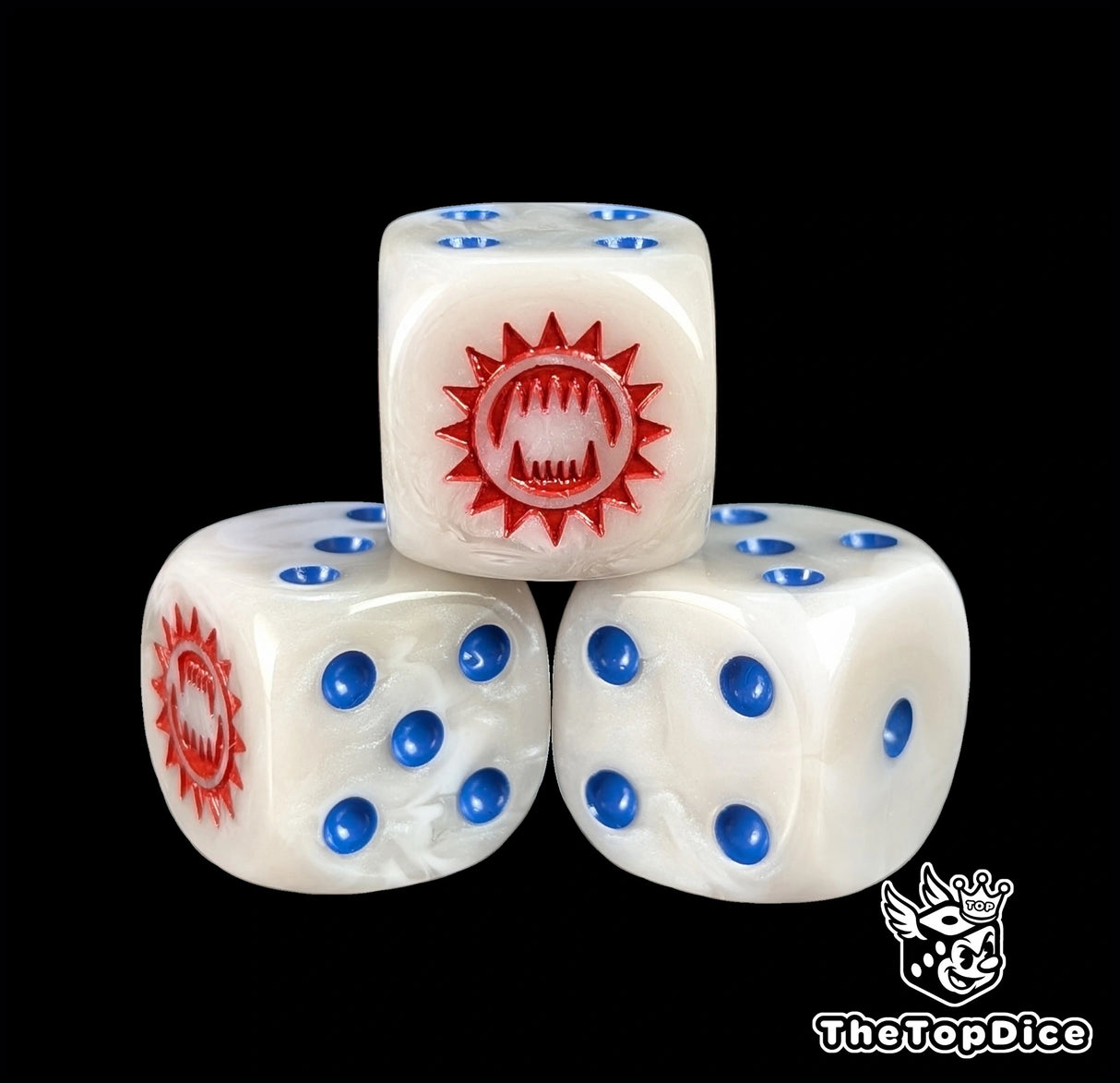 Close up of a white and grey 16mm resin D6 die engraved with a red toothed maw and blue pips