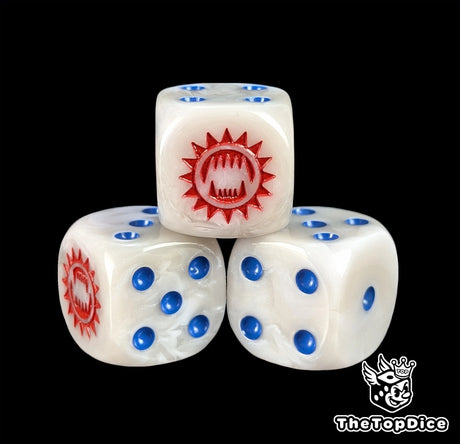 Close up of a white and grey 16mm resin D6 die engraved with a red toothed maw and blue pips