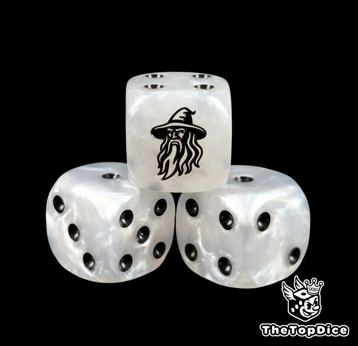Close up of a white 16mm resin D6 die engraved with a black wizard and black pips
