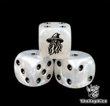 Close up of a white 16mm resin D6 die engraved with a black wizard and black pips