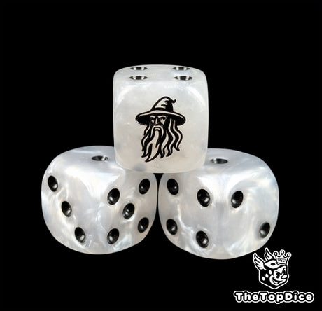 Close up of a white 16mm resin D6 die engraved with a black wizard and black pips