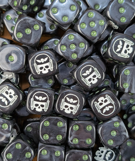 Pile of black and grey winged skull 16mm D6 dice for a sci-fi guard army