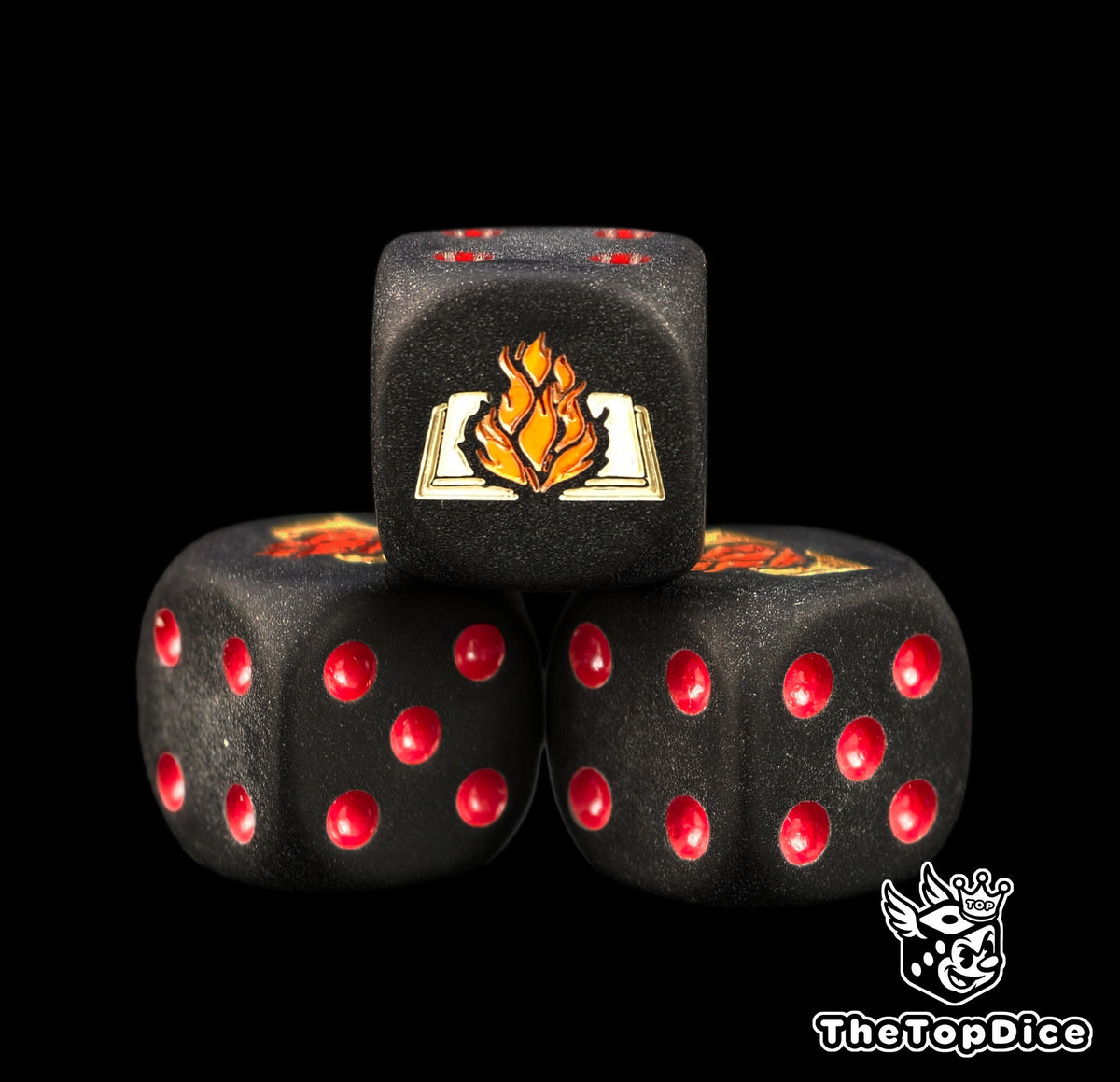 Close up of the burning book of the dark apostle engraved and hand filled on a black Word Bearers 16mm D6 die