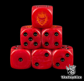 Word Bearers chaos space marine dice, crimson red 16mm resin D6 with black pips and an orange fire daemon face, stacked in a pyramid