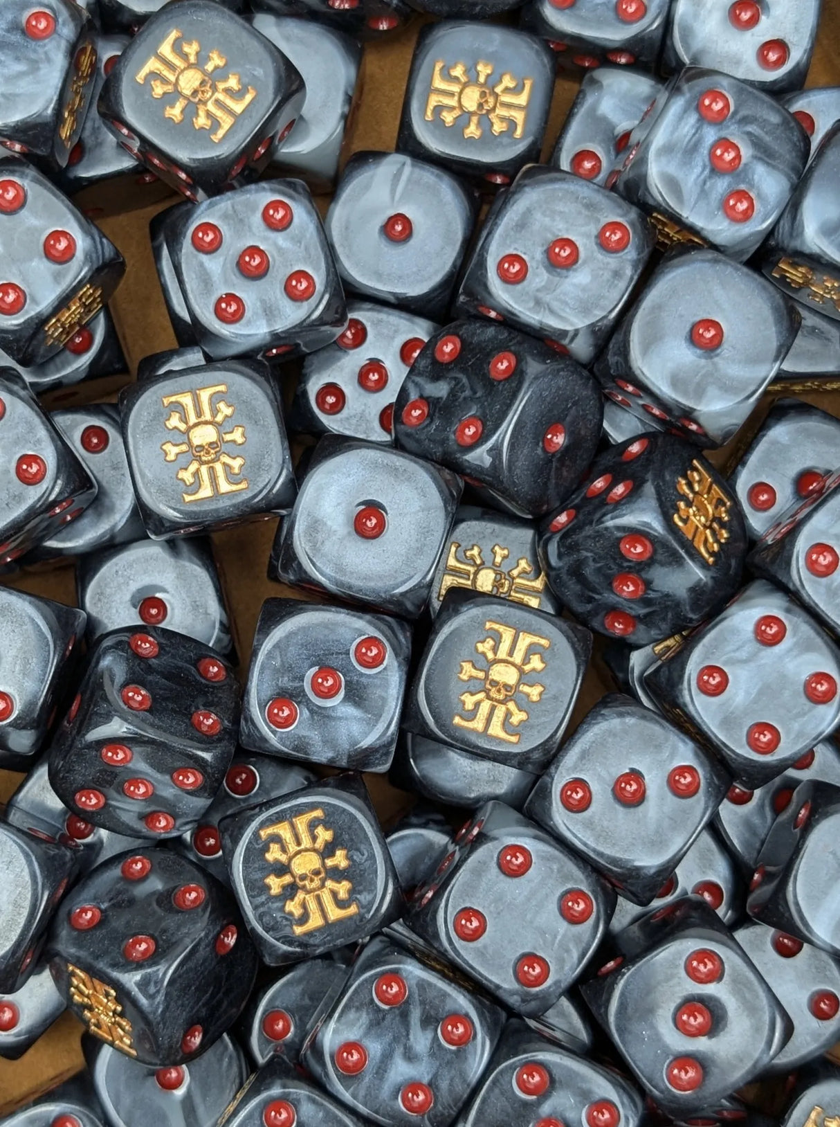 Pile of black and grey xeno hunter 16mm D6 dice for a sci-fi kill team
