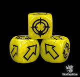 Close up of a yellow resin scatter die showing the black direction arrows