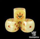 Close up of a yellow 16mm resin D6 die engraved with a lion ship emblem and orange pips