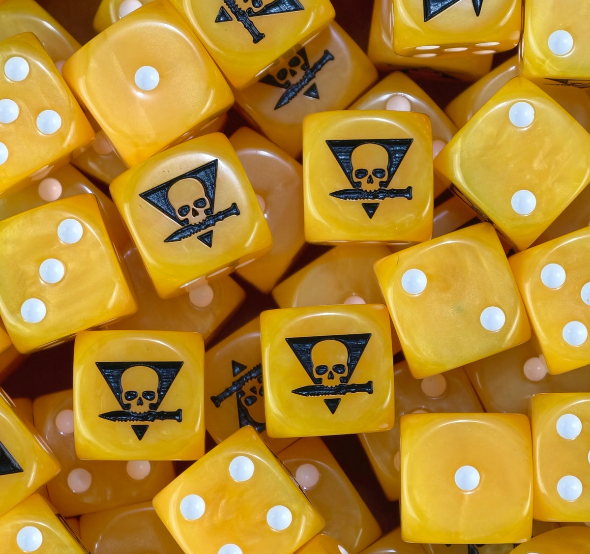 A pile of yellow Kill Team D6 with white pips and black skull knives